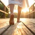 Gentle Light and Motion over Bare Feet on Wood Royalty Free Stock Photo