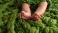 baby legs on green wool blanket Royalty Free Stock Photo