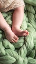 baby legs on green wool blanket Royalty Free Stock Photo