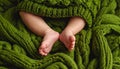 baby legs on green wool blanket Royalty Free Stock Photo