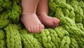 baby legs on green wool blanket Royalty Free Stock Photo