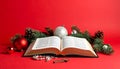 Christmas red background with Bible and rosary on the table Royalty Free Stock Photo