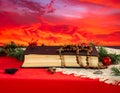 Christmas red background with Bible and rosary on the table Royalty Free Stock Photo
