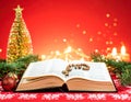 Christmas red background with Bible and rosary on the table Royalty Free Stock Photo