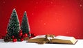Christmas red background with Bible and rosary on the table Royalty Free Stock Photo