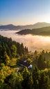 The beautiful view of the houses and trees covered in morning mist. Royalty Free Stock Photo