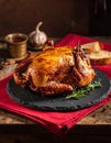 Cozy Low Light Dinner with Roast Duck and Red Napkin Royalty Free Stock Photo
