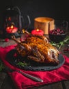 Cozy Low Light Dinner with Roast Duck and Red Napkin Royalty Free Stock Photo