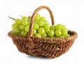 Wicker basket with fresh green grapes on white background Royalty Free Stock Photo