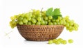 Wicker basket with fresh green grapes on white background Royalty Free Stock Photo