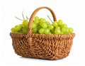 Wicker basket with fresh green grapes on white background Royalty Free Stock Photo