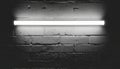 Bright Fluorescent Light Tube on Dark Textured Brick Wall Royalty Free Stock Photo
