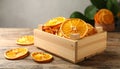 Crate of dry orange slices on wooden table, closeup Royalty Free Stock Photo