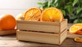 Crate of dry orange slices on wooden table, closeup Royalty Free Stock Photo