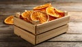 Crate of dry orange slices on wooden table, closeup Royalty Free Stock Photo