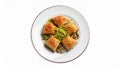 Plate of delicious baklava with pistachio nuts on white background, top view Royalty Free Stock Photo