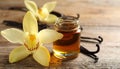 Aromatic vanilla extract, pods and flower on wooden table, closeup Royalty Free Stock Photo