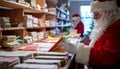 Santa Claus Reading Letters at North Pole Post Office Royalty Free Stock Photo