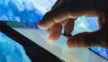 Close-up of Hand Interacting with a Tablet Screen Royalty Free Stock Photo