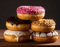 Four fresh donuts on each other Royalty Free Stock Photo