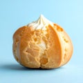 Lone Cream Puff on Pastel Blue Background with Soft Feminine Mood Royalty Free Stock Photo