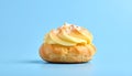 Lone Cream Puff on Pastel Blue Background with Soft Feminine Mood Royalty Free Stock Photo