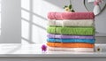 Freshly colored towels on the white table at home, shut up. Text area Royalty Free Stock Photo
