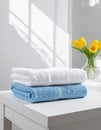 Freshly colored towels on the white table at home, shut up. Text area Royalty Free Stock Photo