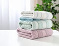 Freshly colored towels on the white table at home, shut up. Text area Royalty Free Stock Photo
