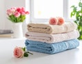 Freshly colored towels on the white table at home, shut up. Text area Royalty Free Stock Photo