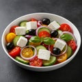 A fresh Greek salad is presented in a white bowl. Royalty Free Stock Photo