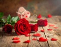 Red roses with hearts on a old wooden table, valentines day Royalty Free Stock Photo