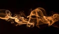 Brown coloured smoke abstract lighting on a black background Royalty Free Stock Photo