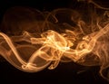 Brown coloured smoke abstract lighting on a black background Royalty Free Stock Photo