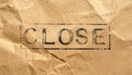Stamped CLOSE Text on Rough Kraft Paper Natural Texture Royalty Free Stock Photo