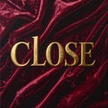 Gold Embossed CLOSE Text on Deep Burgundy Velvet Texture Royalty Free Stock Photo