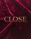 Gold Embossed CLOSE Text on Deep Burgundy Velvet Texture Royalty Free Stock Photo