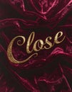 Gold Embossed CLOSE Text on Deep Burgundy Velvet Texture Royalty Free Stock Photo