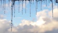 Melting Icicles Against a Bright Winter Sky Royalty Free Stock Photo