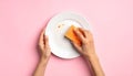 Woman washing dirty plate with sponge on pink background, top view Royalty Free Stock Photo