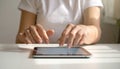 Close-up photo of female hands working with tablet computer. Woman using social network Royalty Free Stock Photo