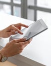 Close-up photo of female hands working with tablet computer. Woman using social network Royalty Free Stock Photo