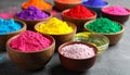 Colorful powder dyes on grey background, closeup. Holi festival Royalty Free Stock Photo