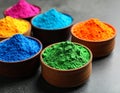 Colorful powder dyes on grey background, closeup. Holi festival Royalty Free Stock Photo