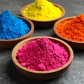 Colorful powder dyes on grey background, closeup. Holi festival Royalty Free Stock Photo