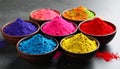 Colorful powder dyes on grey background, closeup. Holi festival Royalty Free Stock Photo