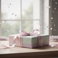A neatly wrapped rectangular gift box sits on a wooden table. Royalty Free Stock Photo
