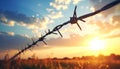 Barbed wire fencing on a sky background. Close up Royalty Free Stock Photo