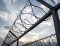 Barbed wire fencing on a sky background. Close up Royalty Free Stock Photo