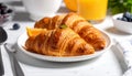 Tasty croissants for breakfast on white plate Royalty Free Stock Photo